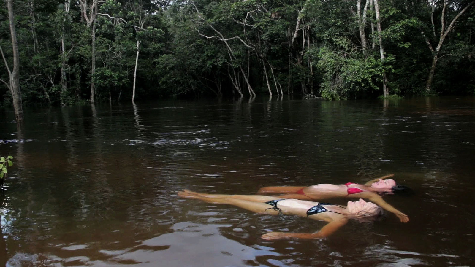 Amazona. Val and Clare floating in the river